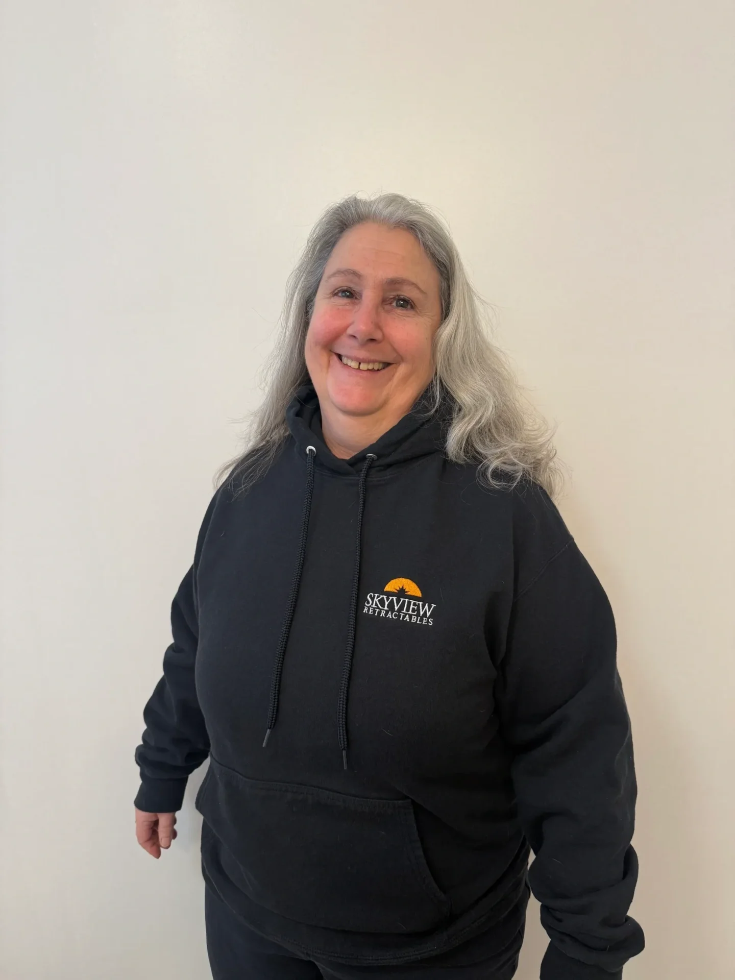 A woman wearing black hoodie